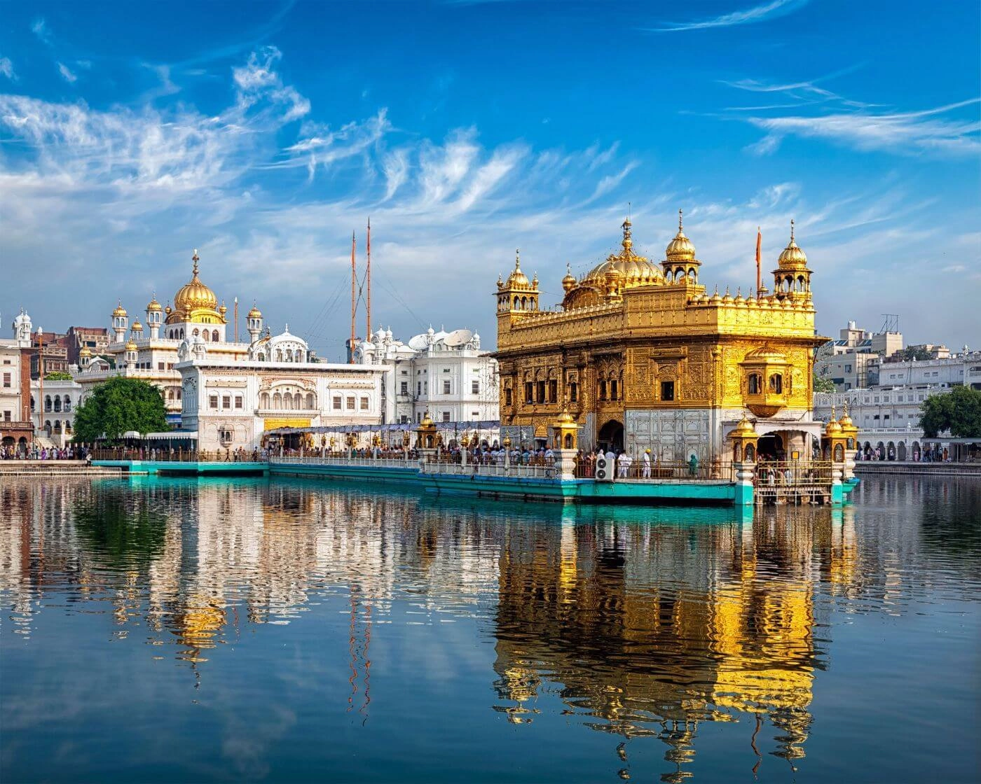Golden Temple illuminated at night with Amrit Sarovar reflection, Amritsar