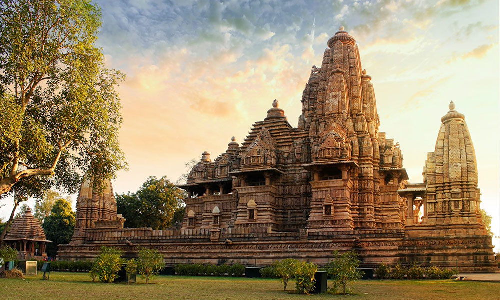 Intricately carved sandstone sculptures on Khajuraho temple wall, Madhya Pradesh