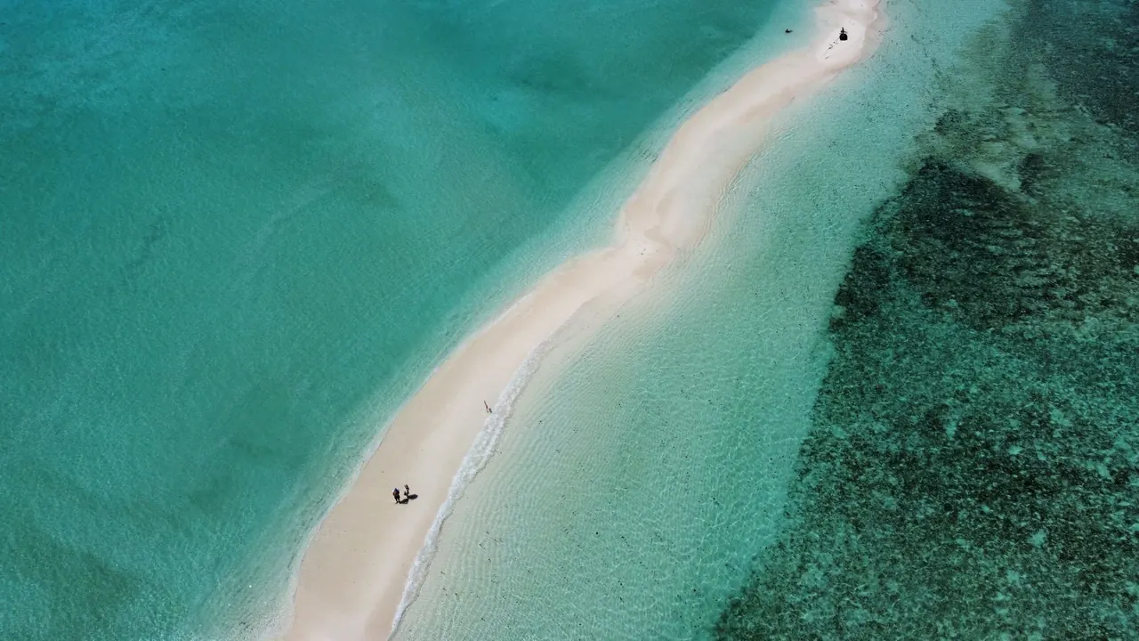 Aerial view of a sandbank and shallow lagoon in the Maldives